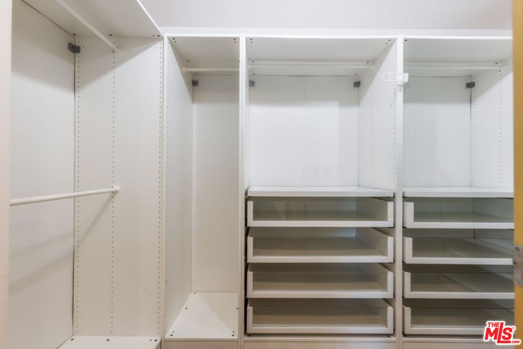 4300 Vía Dolce, Unit 102 Marina del Rey, CA 90292 - Photo 29 of 39 a view of walk in closet with empty racks