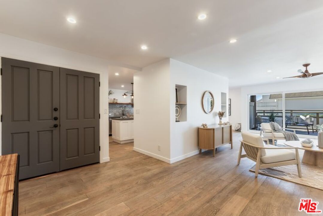 4300 Vía Dolce, Unit 102 Marina del Rey, CA 90292 - Photo 3 of 39 a view of kitchen with furniture and wooden floor