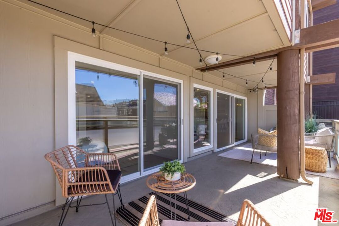 4300 Vía Dolce, Unit 102 Marina del Rey, CA 90292 - Photo 36 of 39 a dining room with furniture a rug and a large window