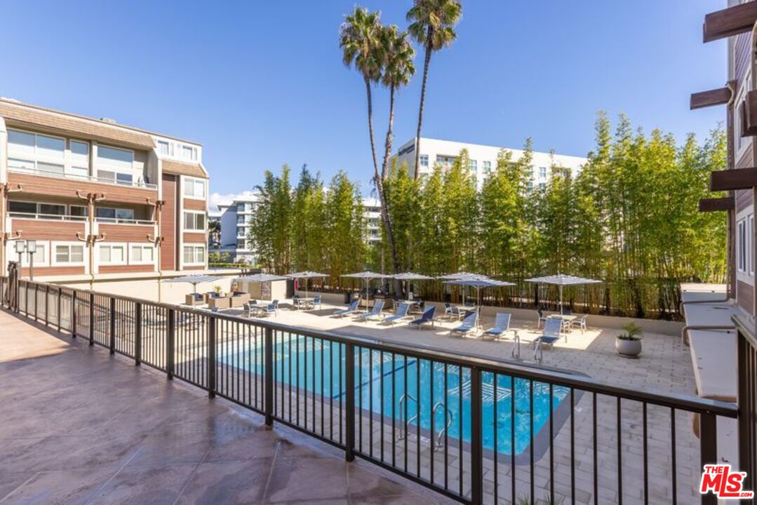 4300 Vía Dolce, Unit 102 Marina del Rey, CA 90292 - Photo 37 of 39 a view of a balcony with potted plants