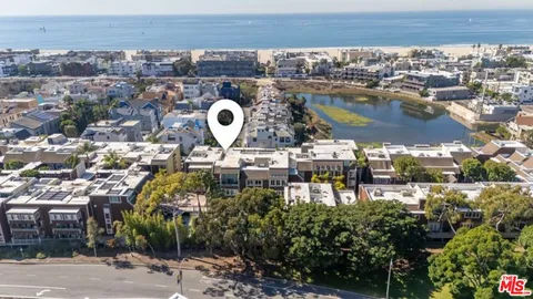an aerial view of a house with a swimming pool