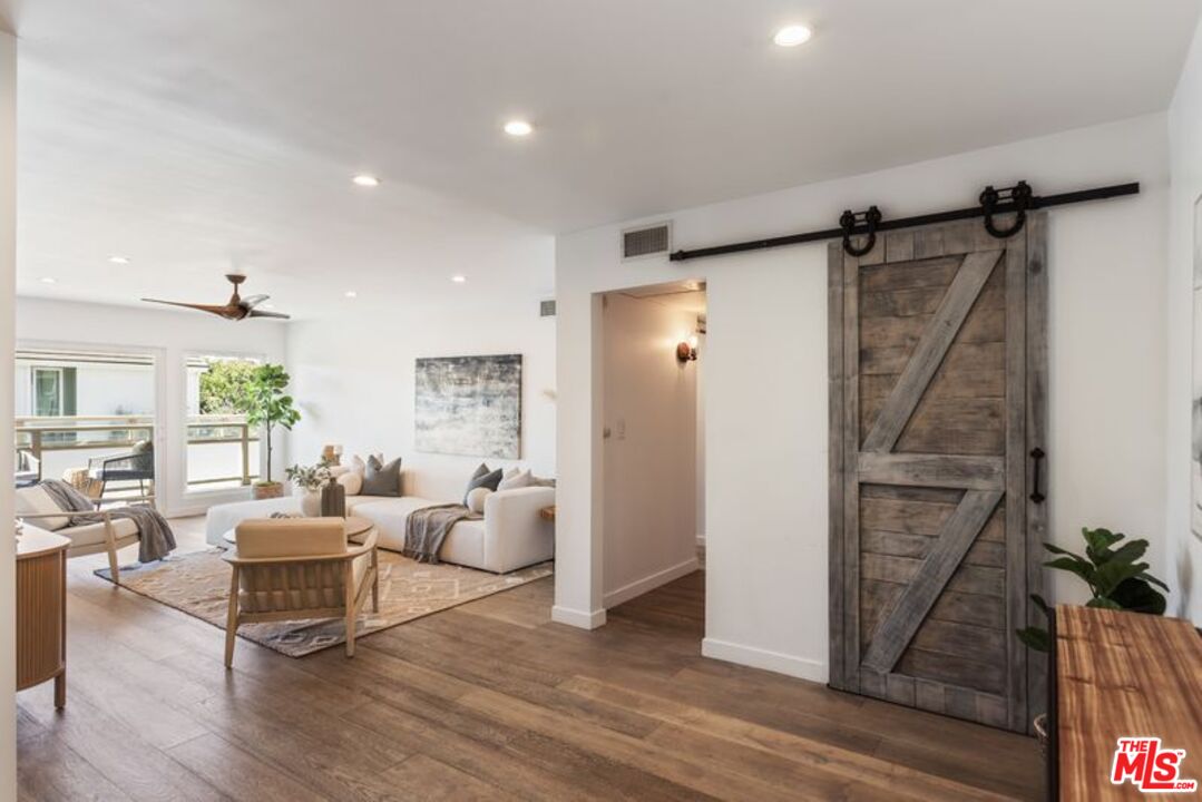 4300 Vía Dolce, Unit 102 Marina del Rey, CA 90292 - Photo 5 of 39 a living room with furniture and a refrigerator