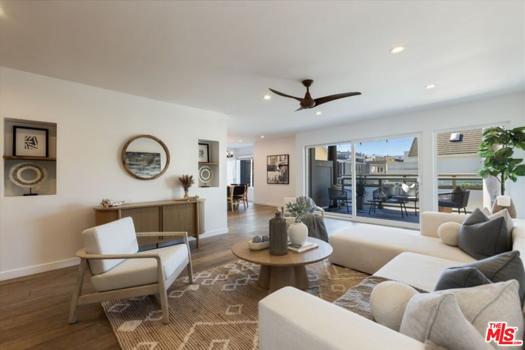 4300 Vía Dolce, Unit 102 Marina del Rey, CA 90292 - Photo 6 of 39 a living room with furniture and a large window