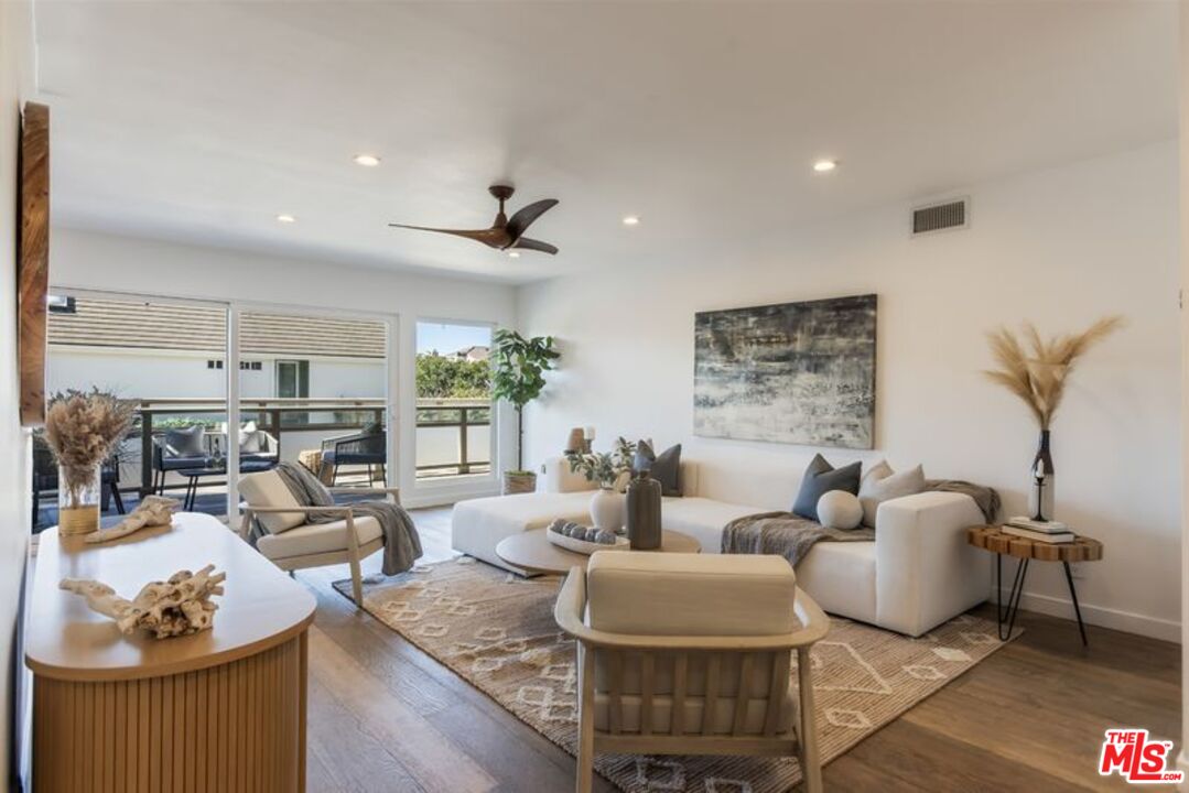 4300 Vía Dolce, Unit 102 Marina del Rey, CA 90292 - Photo 7 of 39 a living room with furniture and a table
