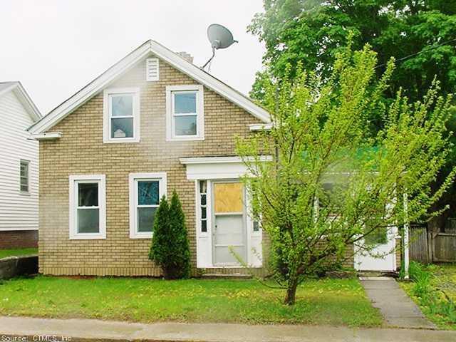 65 Cottage Street Killingly, CT 06239 - Photo 1 of 1 a front view of a house with a yard
