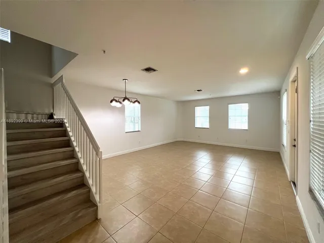 a view of entryway and hall with a window