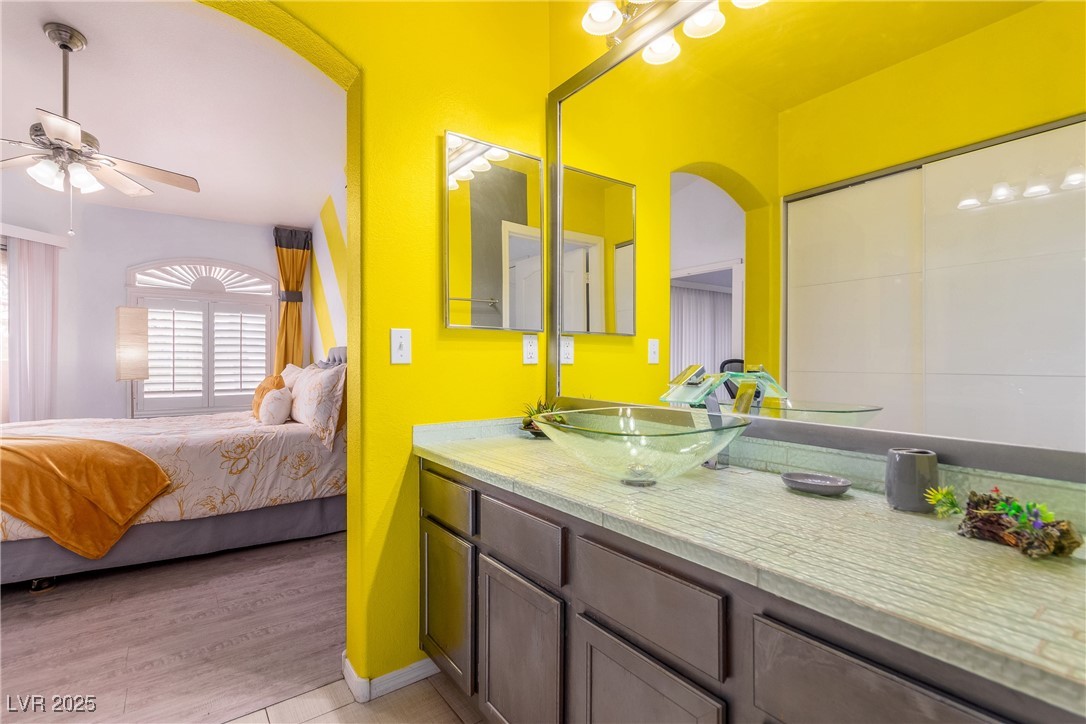 7400 West Flamingo Road, Unit 2006 Las Vegas, NV 89147 - Photo 20 of 30 Ensuite bathroom featuring a ceiling fan and vanity