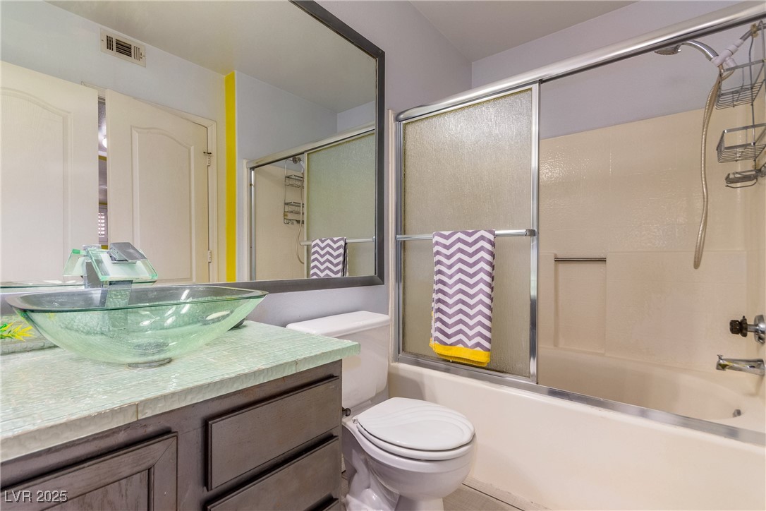 7400 West Flamingo Road, Unit 2006 Las Vegas, NV 89147 - Photo 26 of 30 Bathroom featuring vanity and combined bath / shower with glass door