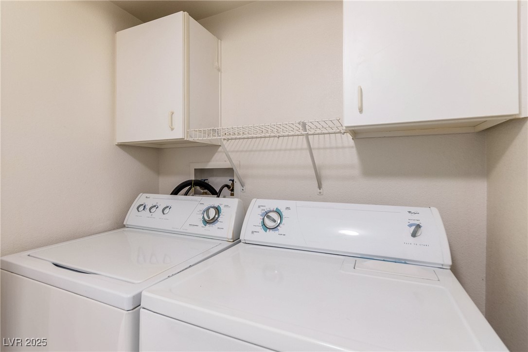 7400 West Flamingo Road, Unit 2006 Las Vegas, NV 89147 - Photo 27 of 30 Washroom with washer and dryer and cabinet space