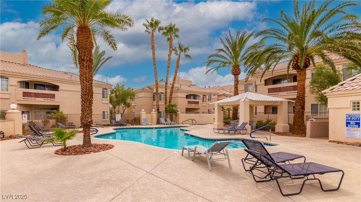 7400 West Flamingo Road, Unit 2006 Las Vegas, NV 89147 - Photo 28 of 30 Community pool featuring a residential view and a patio