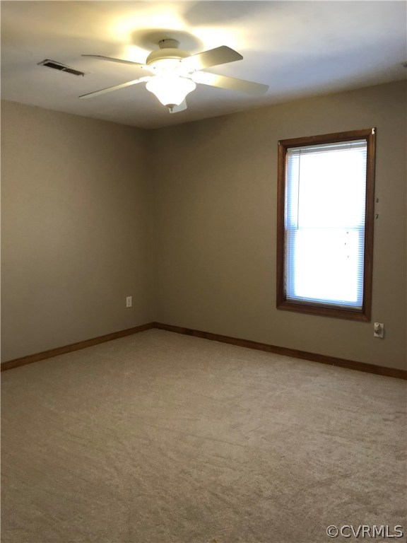 7721 Deer Run Road New Kent, VA 23124 - Photo 13 of 22 a view of a room that has a window in it