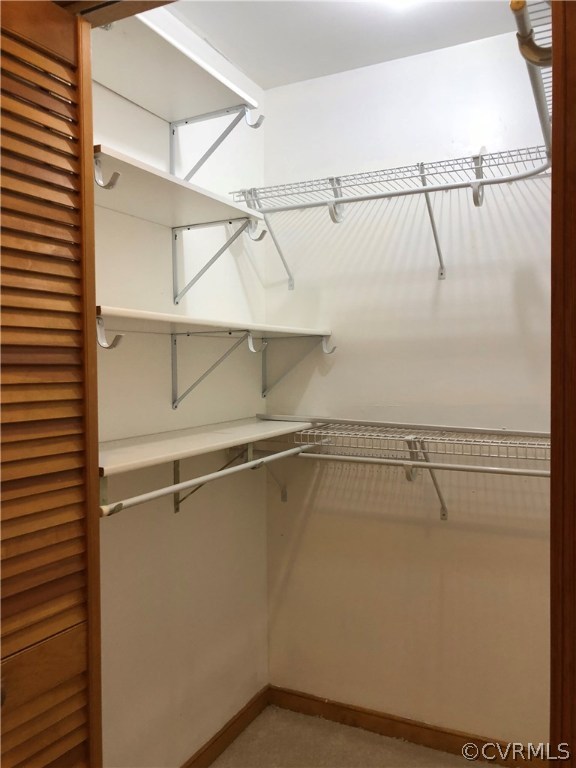 7721 Deer Run Road New Kent, VA 23124 - Photo 17 of 22 a view of a room with racks on the wall