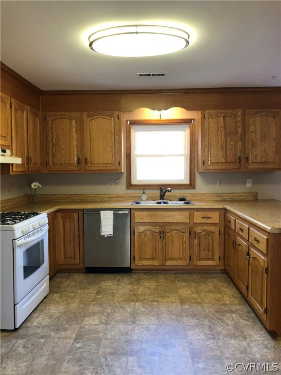 7721 Deer Run Road New Kent, VA 23124 - Photo 2 of 22 a kitchen with stainless steel appliances granite countertop a stove a sink and a microwave