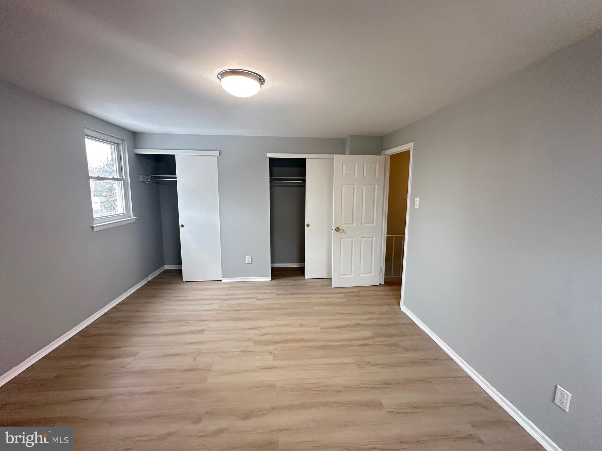 346 Ridgeway Place Philadelphia, PA 19116 - Photo 11 of 19 a view of an empty room with wooden floor and a window