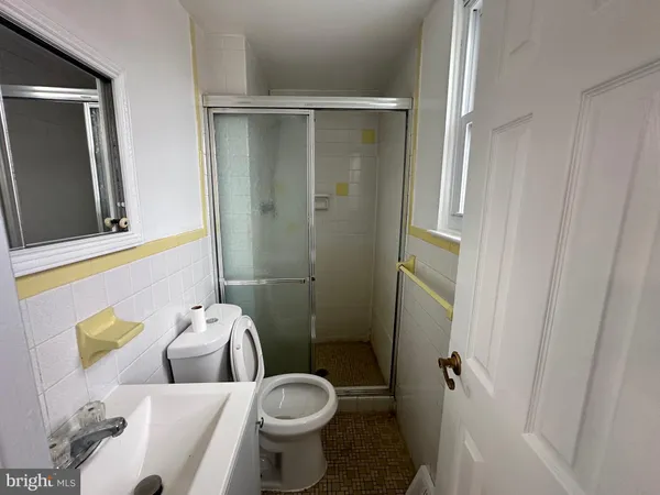 a bathroom with a sink and toilet