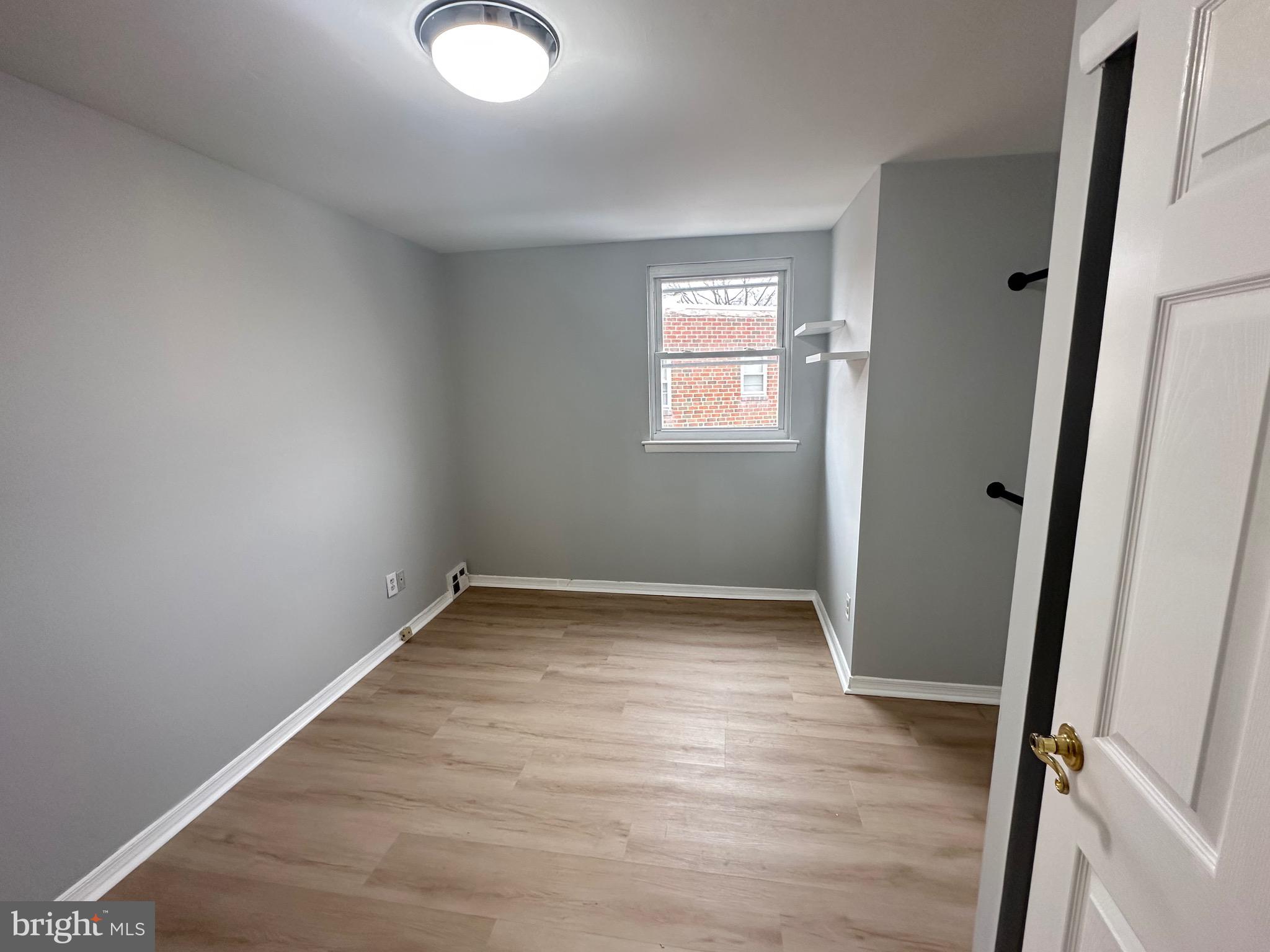 346 Ridgeway Place Philadelphia, PA 19116 - Photo 15 of 19 an empty room with wooden floor and window
