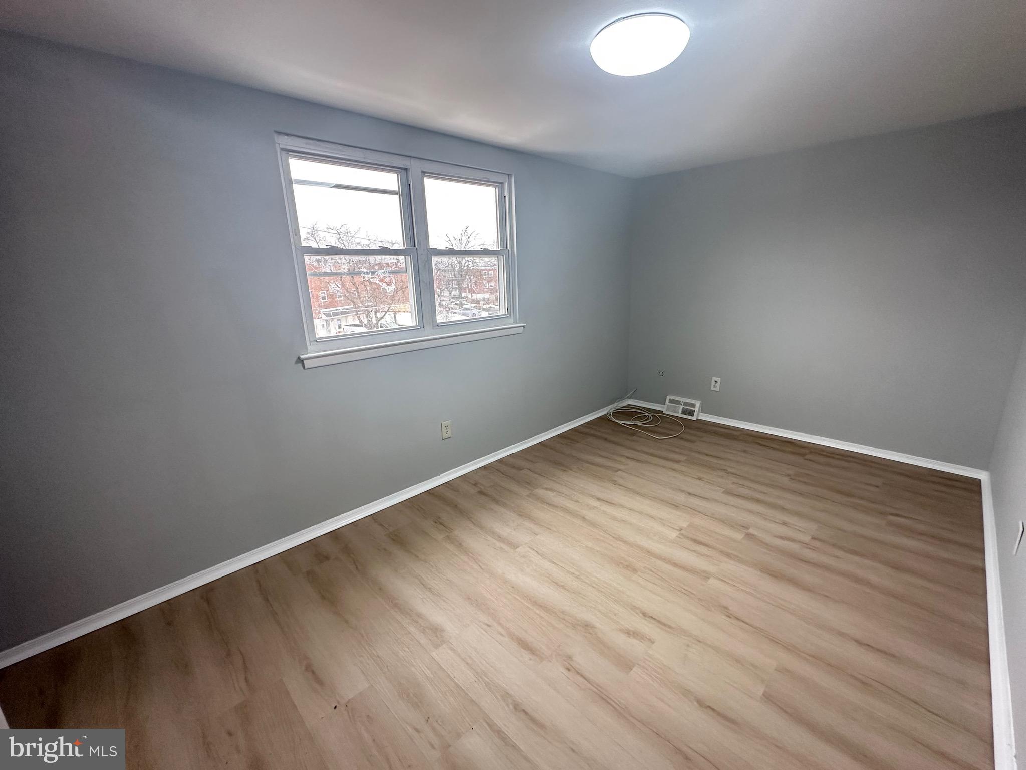346 Ridgeway Place Philadelphia, PA 19116 - Photo 16 of 19 an empty room with wooden floor and windows
