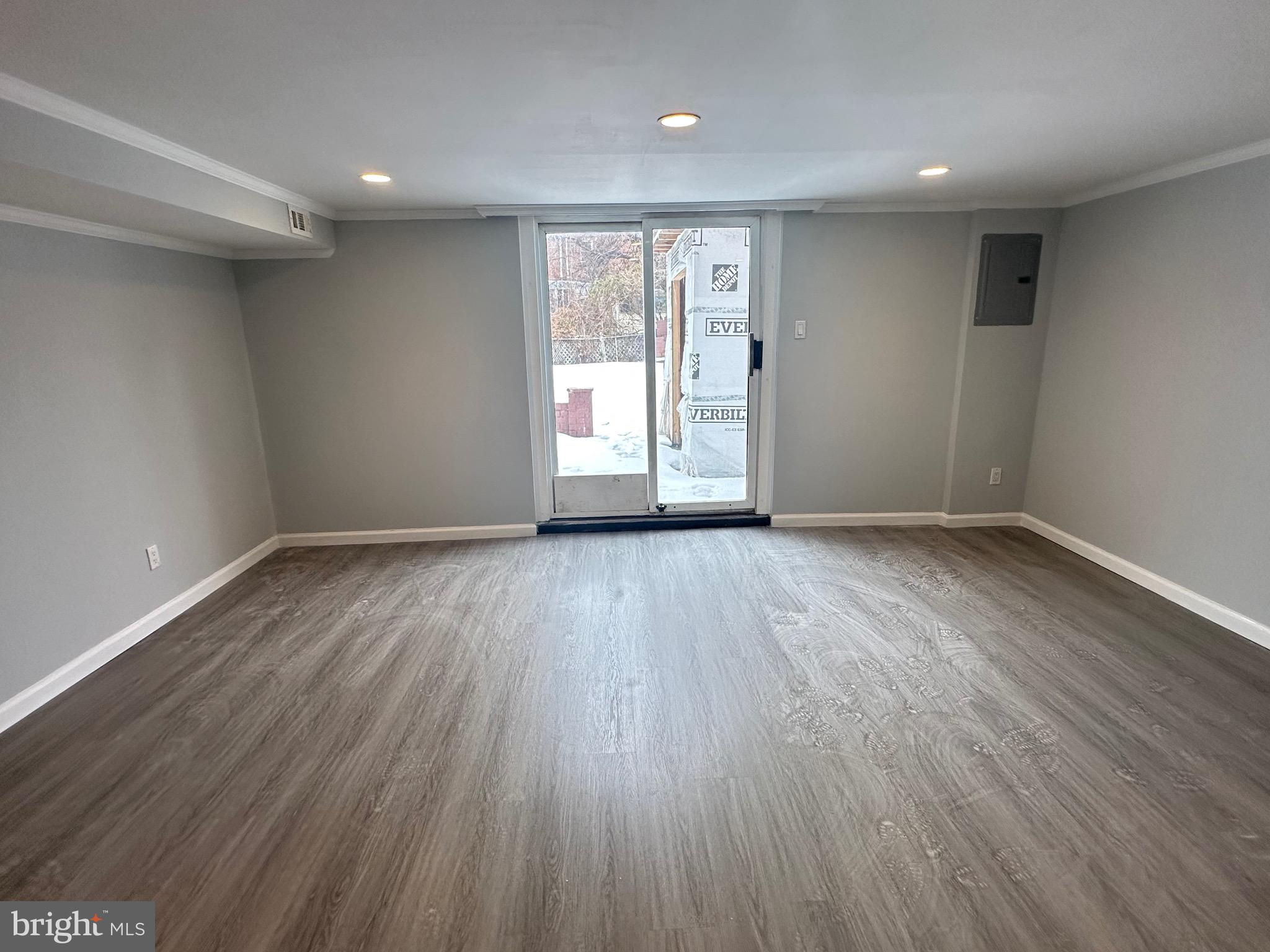 346 Ridgeway Place Philadelphia, PA 19116 - Photo 19 of 19 a view of an empty room with wooden floor and a window