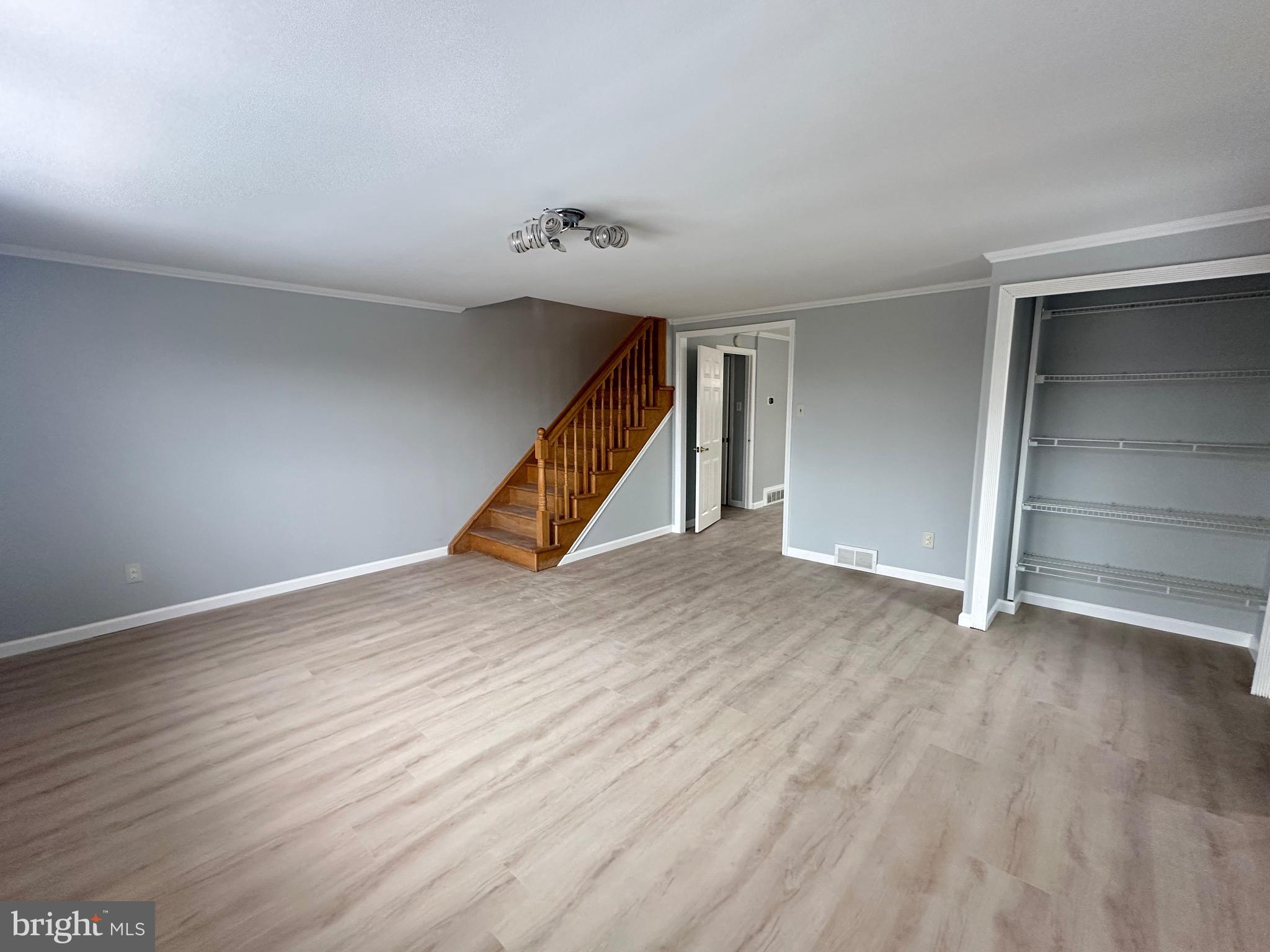 346 Ridgeway Place Philadelphia, PA 19116 - Photo 3 of 19 wooden floor in an empty room with a window