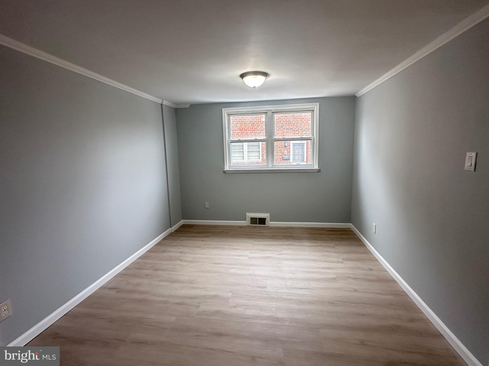 346 Ridgeway Place Philadelphia, PA 19116 - Photo 9 of 19 an empty room with wooden floor and windows