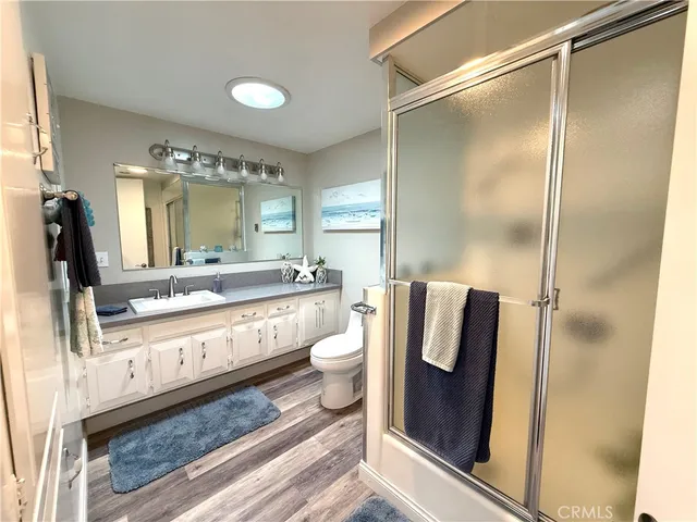 a bathroom with a double vanity sink and mirror