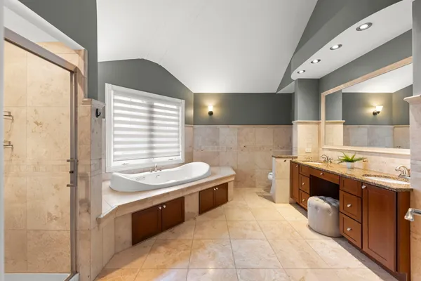 a bedroom with two beds and a window