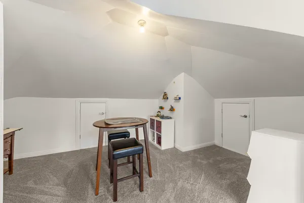 a kitchen with stainless steel appliances granite countertop a refrigerator a sink and a stove with wooden floor