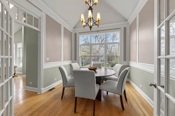 a kitchen with stainless steel appliances granite countertop wooden cabinets a oven and granite counter tops with a large window