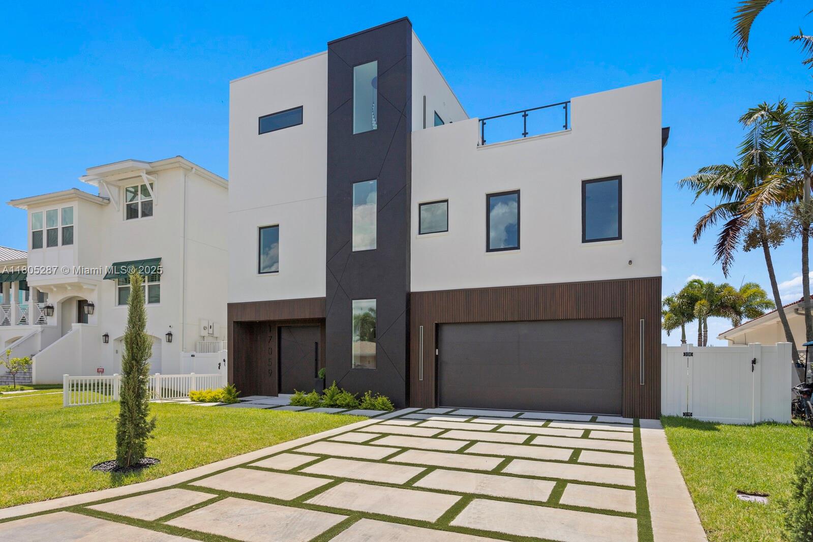 17059 Dolphin Drive St. Petersburg, FL 33708 - Photo 1 of 70 a house view with a garden space