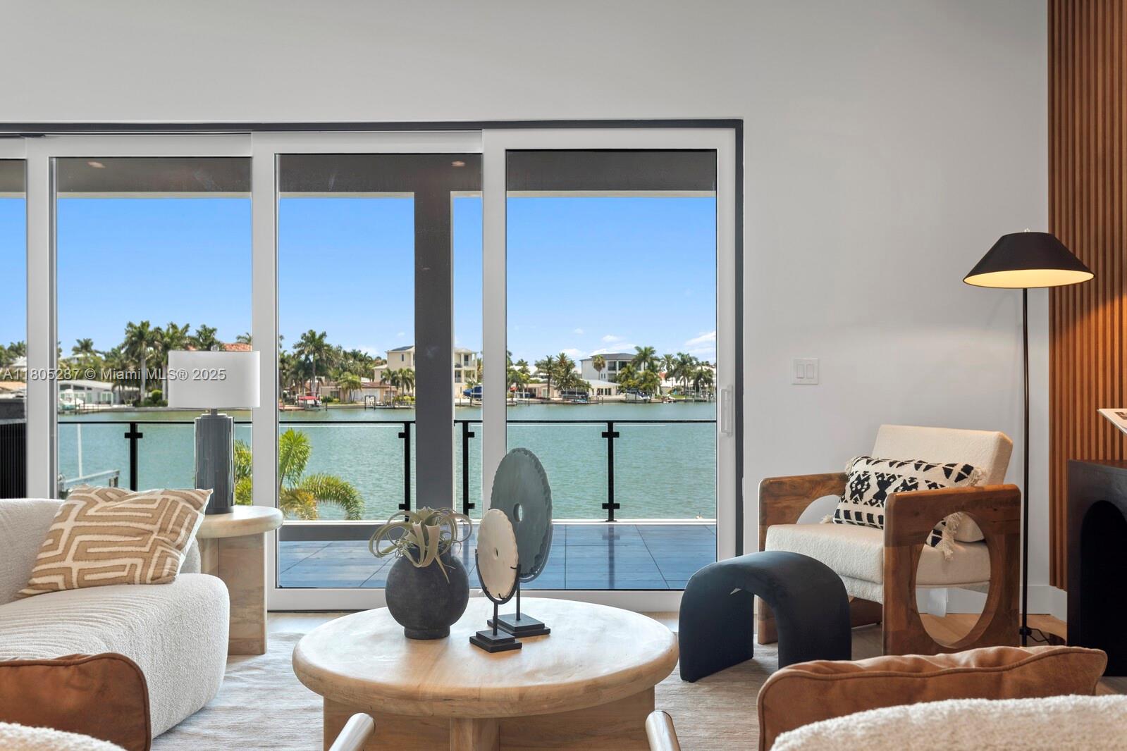 17059 Dolphin Drive St. Petersburg, FL 33708 - Photo 21 of 70 a living room with furniture and a large window