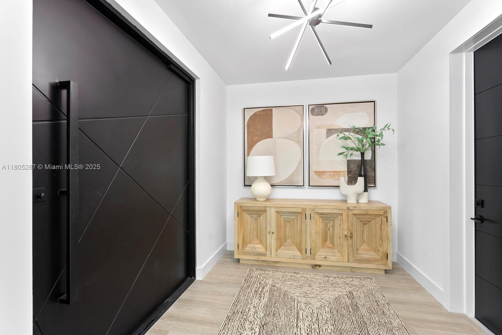 17059 Dolphin Drive St. Petersburg, FL 33708 - Photo 4 of 70 a view of living room with wooden floor and fan