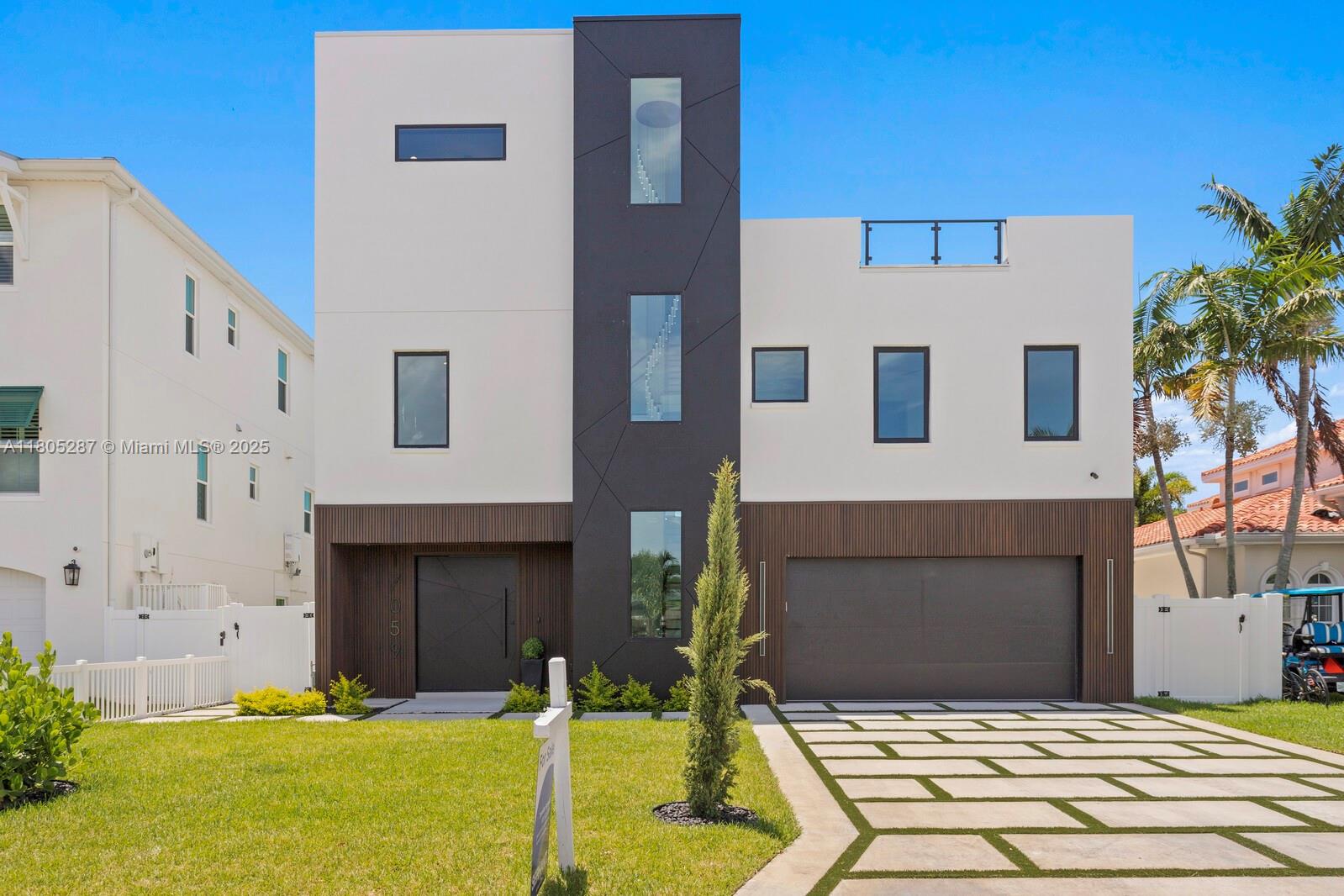 17059 Dolphin Drive St. Petersburg, FL 33708 - Photo 50 of 70 a front view of a house with swimming pool