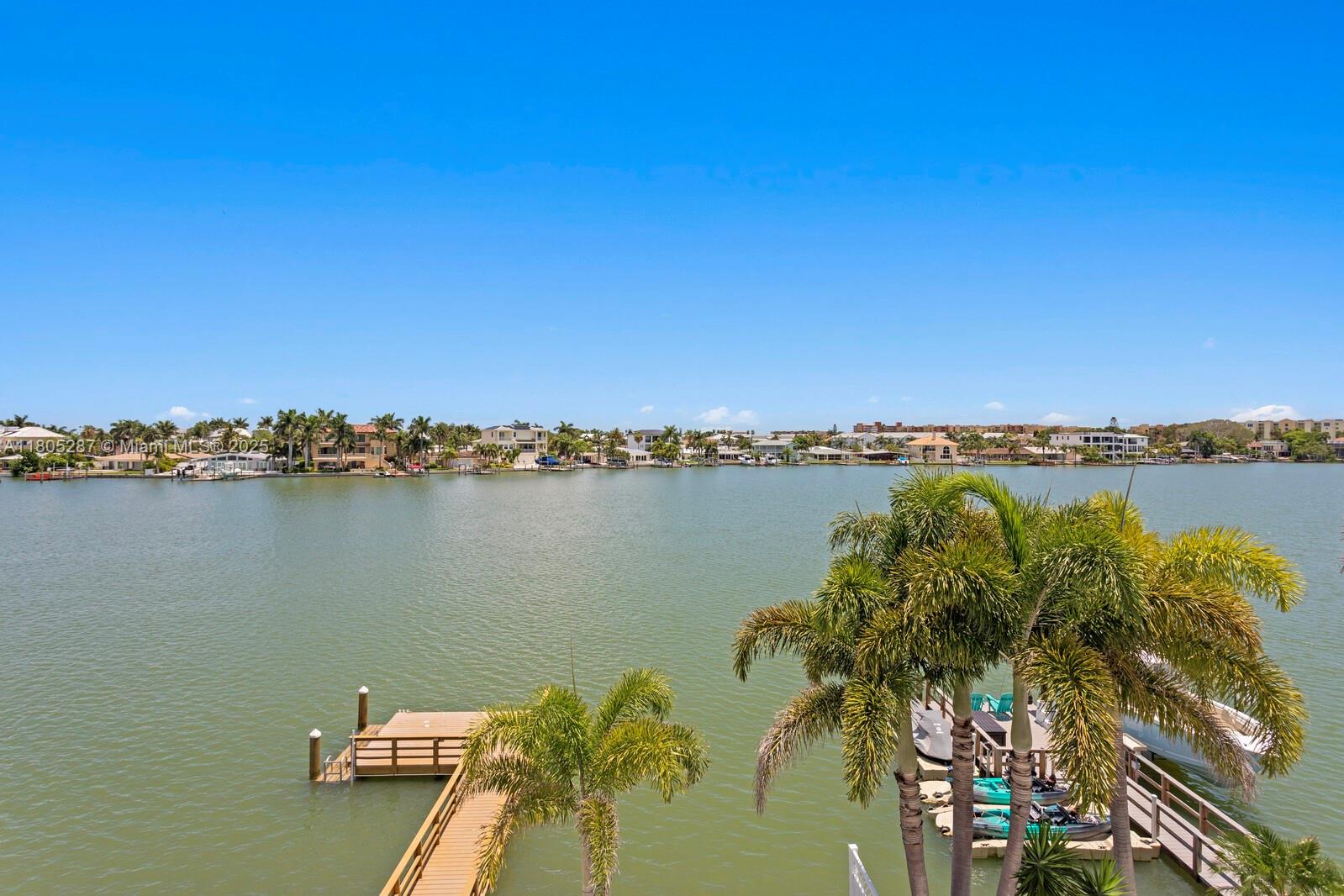 17059 Dolphin Drive St. Petersburg, FL 33708 - Photo 65 of 70 a view of a lake with houses