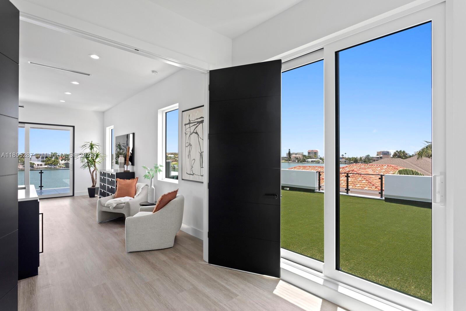 17059 Dolphin Drive St. Petersburg, FL 33708 - Photo 69 of 70 a living room with furniture and a large window