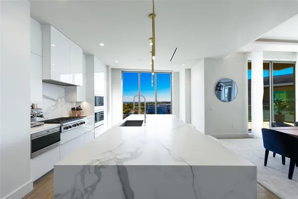 a bedroom with a large bed and a large window