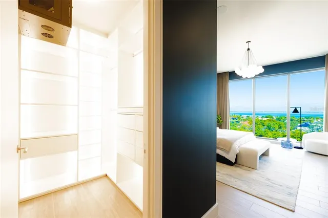 a view of a patio with couches chairs and wooden floor