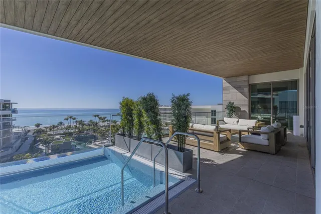 a view of a balcony with two chairs
