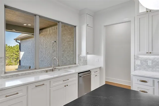a kitchen with stainless steel appliances granite countertop a stove and a refrigerator