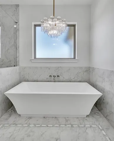 a bathroom with a bathtub and shower