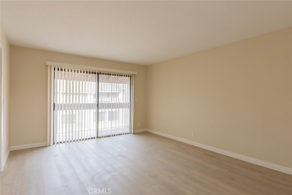 28205 Ridgepoint Court Rancho Palos Verdes, CA 90275 - Photo 16 of 33 an empty room with wooden floor and windows