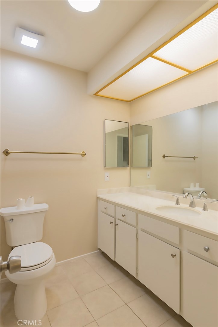 28205 Ridgepoint Court Rancho Palos Verdes, CA 90275 - Photo 21 of 33 a spacious bathroom with a toilet sink and mirror