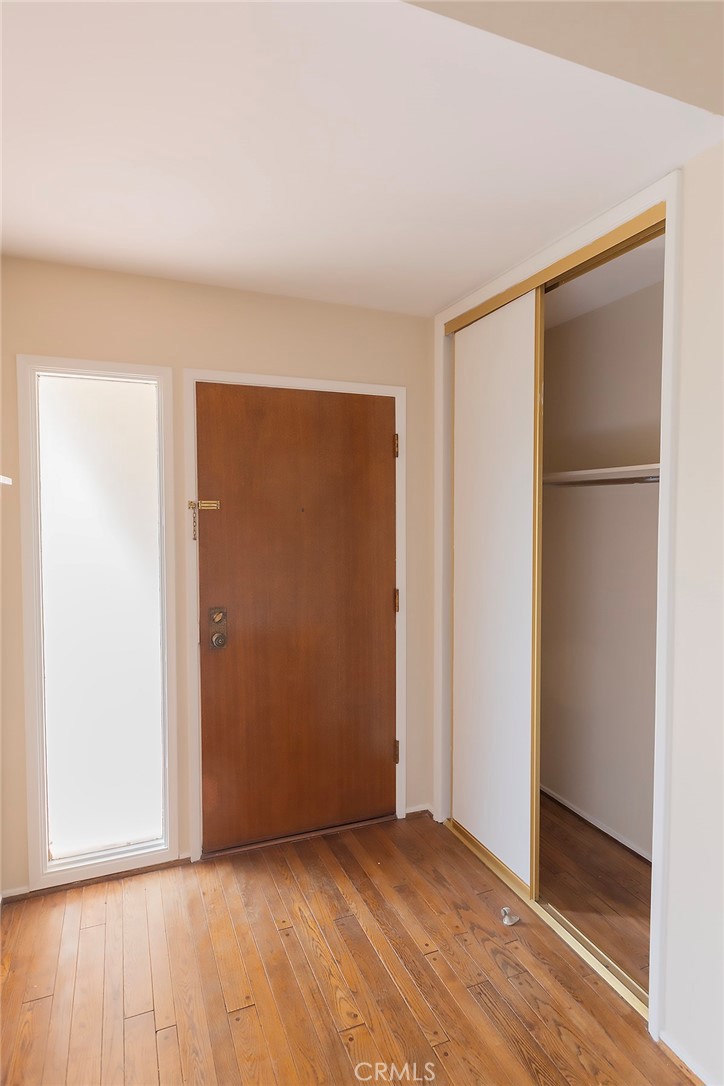 28205 Ridgepoint Court Rancho Palos Verdes, CA 90275 - Photo 3 of 33 a view of an empty room with closet and wooden floor