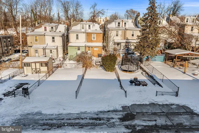 a view of residential houses with outdoor space