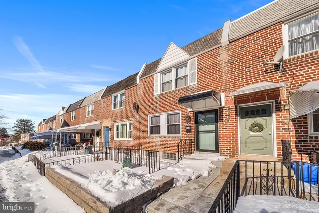 a front view of a building with street view