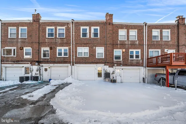 a front view of a building with many windows