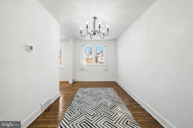 a view of an entryway with wooden floor