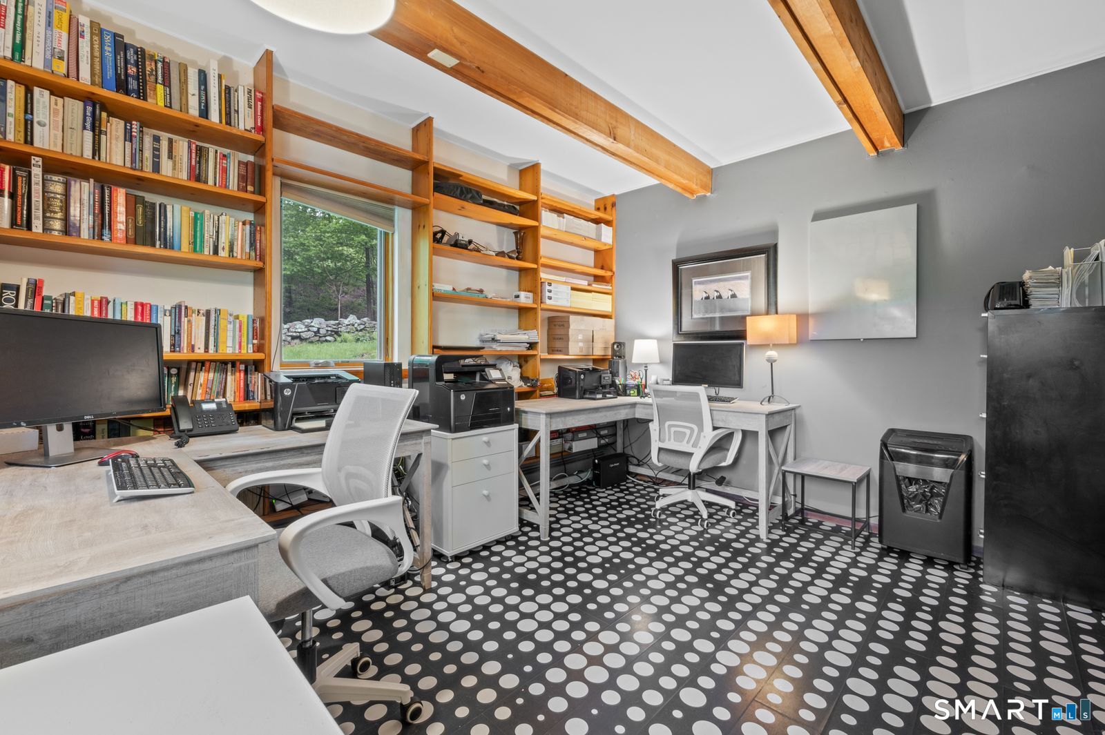 106 Hunt Road Columbia, CT 06237 - Photo 25 of 40 a work room with furniture a bookshelf and a window