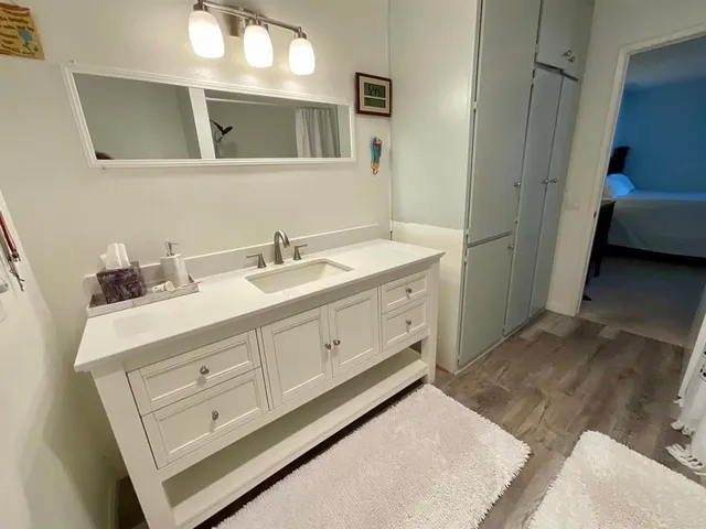 a bathroom with a sink and a mirror