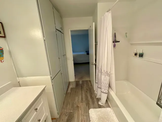 a bathroom with a sink a bathtub and a shower