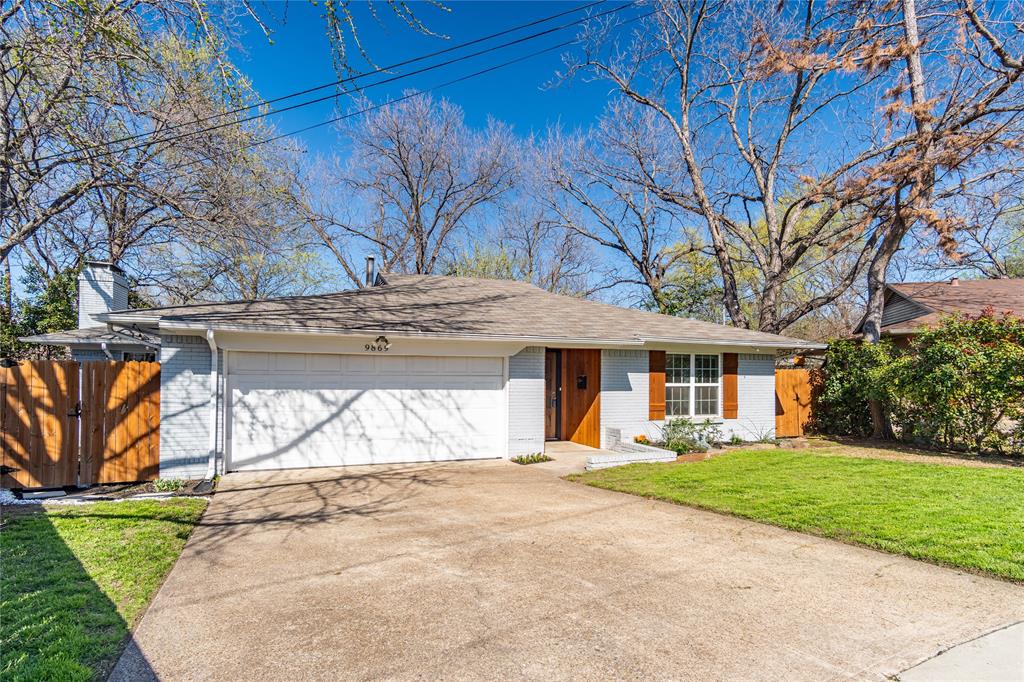 9869 Kingsman Drive Dallas, TX 75228 - Photo 1 of 1 a front view of a house with a yard and trees